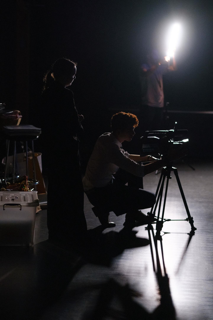 Jack Careem on set, working camera and lighting with the crew